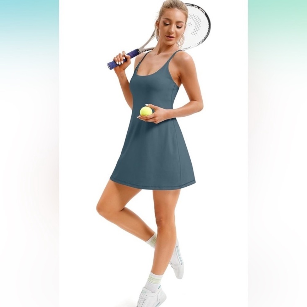 BARELY WORN Teal Tennis dress with built in shorts with 2 pockets and padded bra